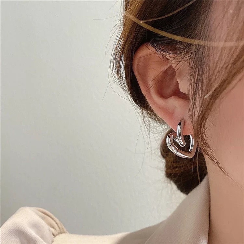 Beautiful and Elegant Heart shaped plated silver earrings.